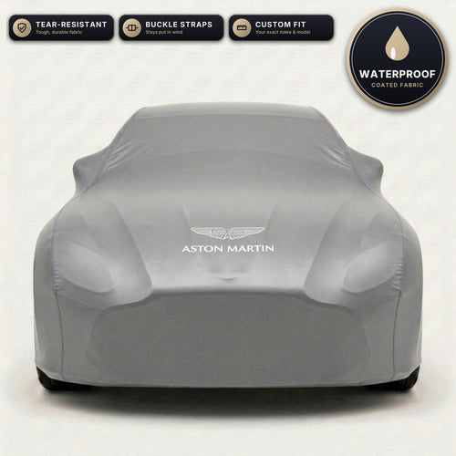 Gray Aston Martin outdoor car cover, waterproof and custom fit, with printed Aston Martin logo