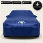 Blue Audi outdoor car cover, waterproof and custom fit, with printed Audi logo