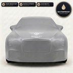Gray Bentley outdoor car cover, waterproof and custom fit, with printed Bentley logo