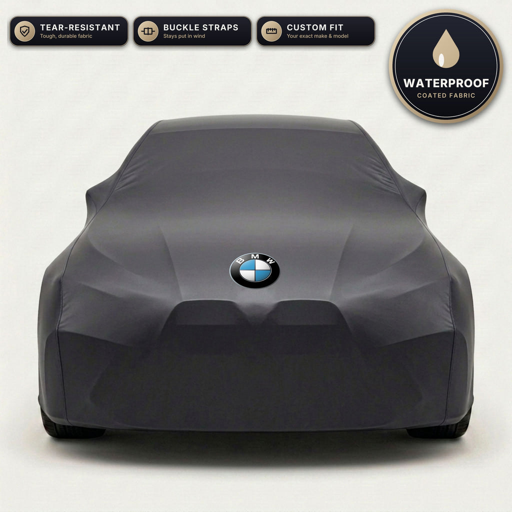 Black BMW outdoor car cover, waterproof and custom fit, with printed BMW logo