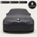 Black BMW outdoor car cover, waterproof and custom fit, with printed BMW logo