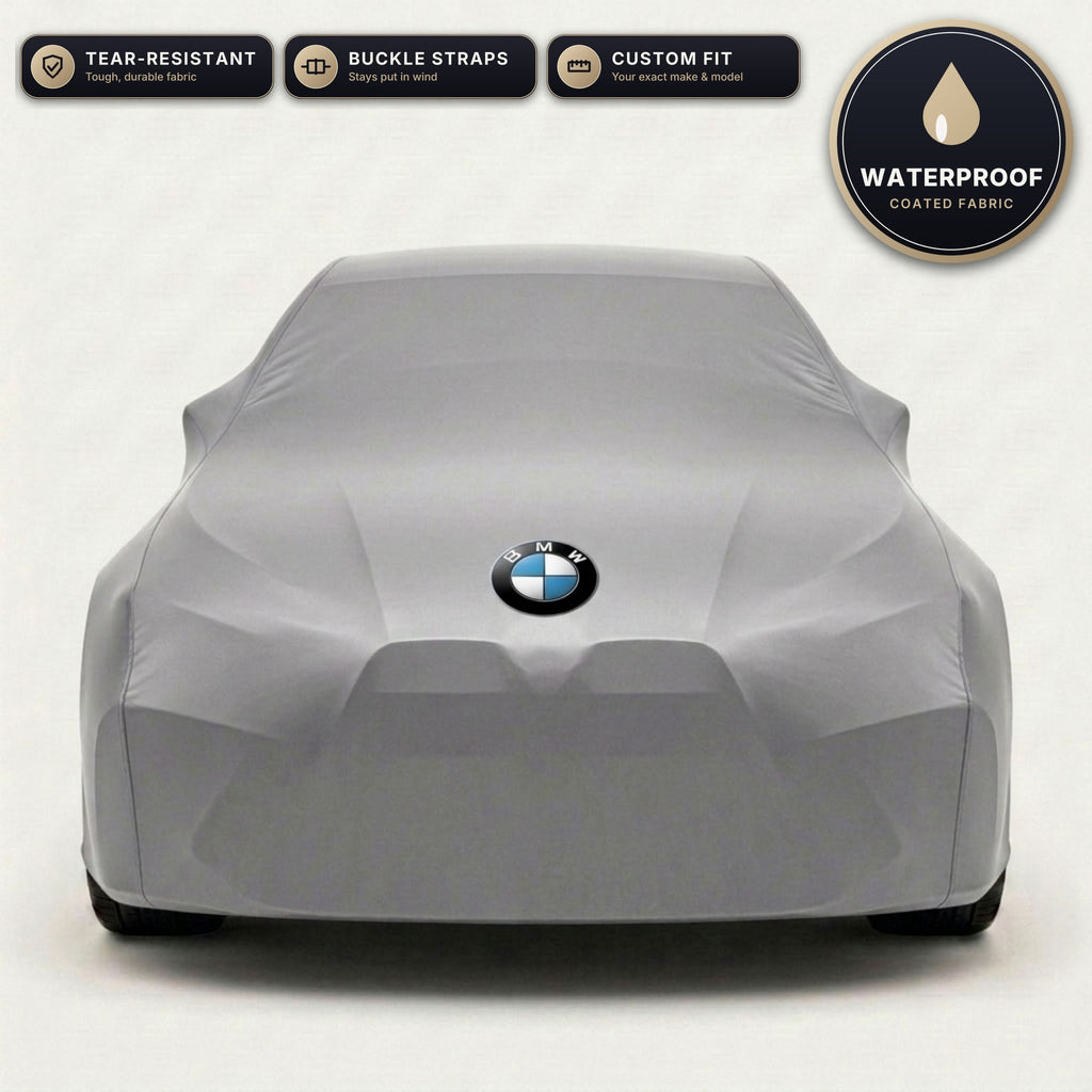 Gray BMW outdoor car cover, waterproof and custom fit, with printed BMW logo