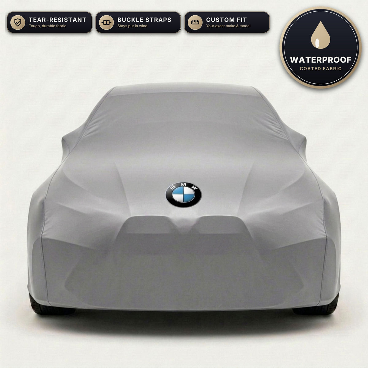 Gray BMW outdoor car cover, waterproof and custom fit, with printed BMW logo