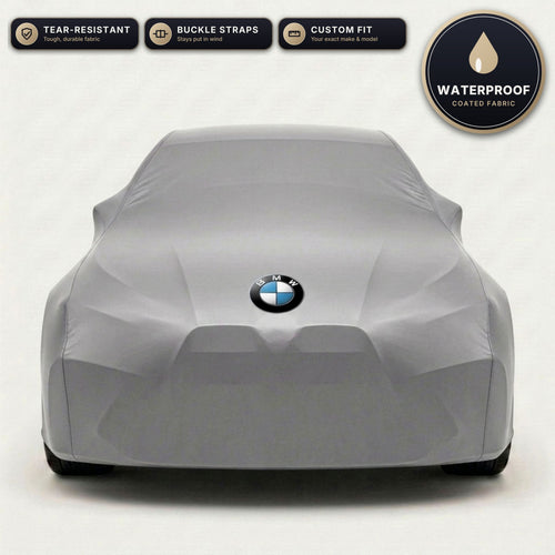 Gray BMW outdoor car cover, waterproof and custom fit, with printed BMW logo