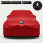 Red BMW outdoor car cover, waterproof and custom fit, with printed BMW logo