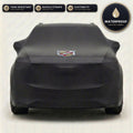 Black Cadillac outdoor car cover, waterproof and custom fit, with printed Cadillac logo