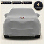 Gray Cadillac outdoor car cover, waterproof and custom fit, with printed Cadillac logo