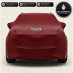 Red Cadillac outdoor car cover, waterproof and custom fit, with printed Cadillac logo