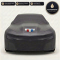 Black Chevrolet Camaro outdoor car cover, waterproof and custom fit, with printed Camaro logo