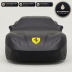 Black Ferrari outdoor car cover, waterproof and custom fit, with printed Ferrari logo