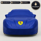 Blue Ferrari outdoor car cover, waterproof and custom fit, with printed Ferrari logo