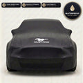 Black Ford Mustang outdoor car cover, waterproof and custom fit, with printed Mustang logo