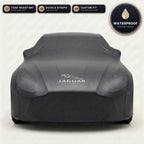 Black Jaguar outdoor car cover, waterproof and custom fit, with printed Jaguar logo