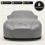 Gray Jaguar outdoor car cover, waterproof and custom fit, with printed Jaguar logo