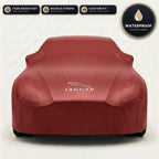 Red Jaguar outdoor car cover, waterproof and custom fit, with printed Jaguar logo