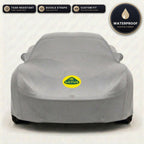 Gray Lotus outdoor car cover, waterproof and custom fit, with printed Lotus logo