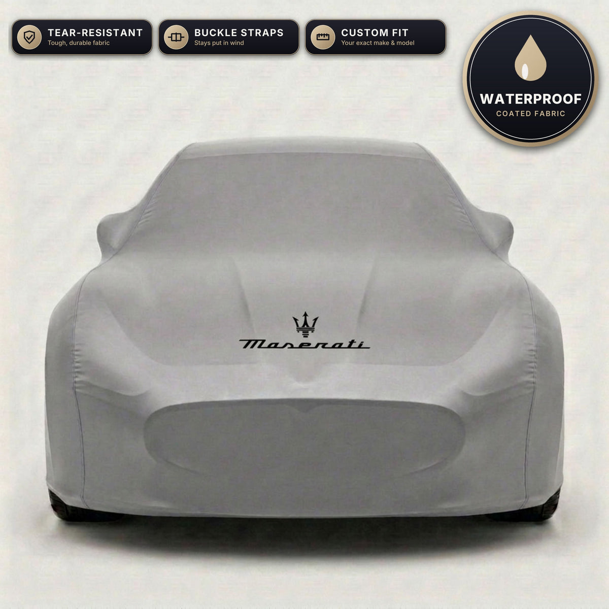 Gray Maserati outdoor car cover, waterproof and custom fit, with printed Maserati logo