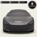 Black McLaren outdoor car cover, waterproof and custom fit, with printed McLaren logo