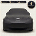 Black Tesla outdoor car cover, waterproof and custom fit, with printed Tesla logo