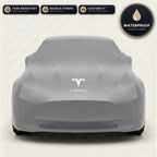 Gray Tesla outdoor car cover, waterproof and custom fit, with printed Tesla logo