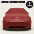 Red Tesla outdoor car cover, waterproof and custom fit, with printed Tesla logo